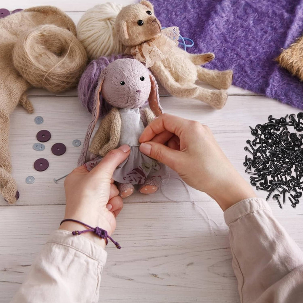 Crocheted stuffed animals with black safety eyes attached