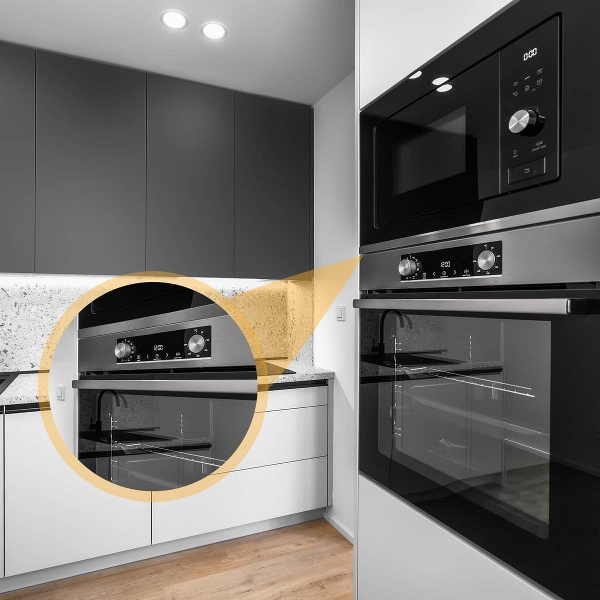 Brushed black stainless steel gap filler strips on oven edge, brushed surface