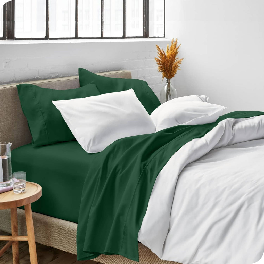 Forest green twin sheet set on bed with white pillows