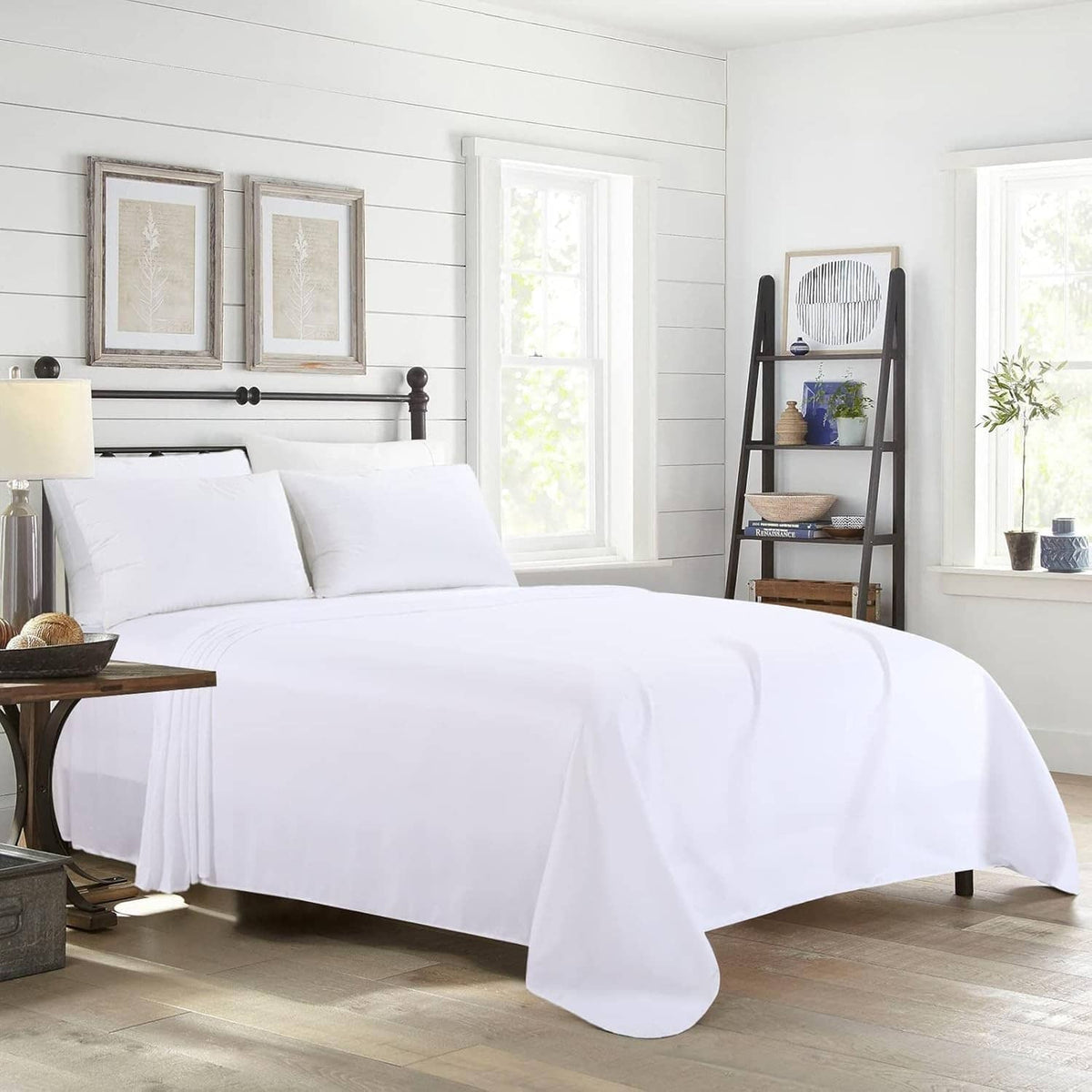 White king flat sheet and pillows on a bed with long fabric overhang
