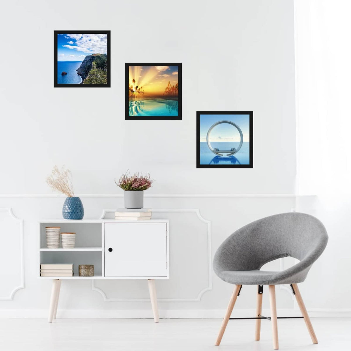 Black square picture frame with clear plexiglass front, holding ocean-view artwork