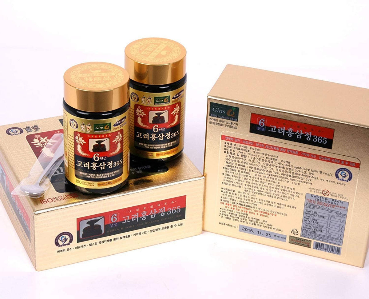 Hongsamjeong ginseng extract bottles with gold caps and cardboard box packaging