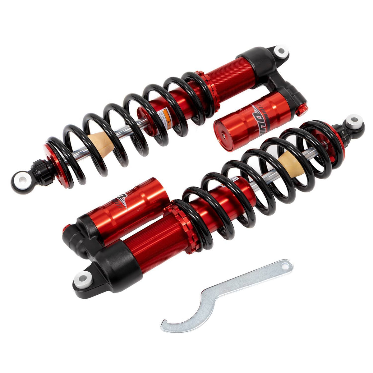 Red and black coil shock absorbers with tan spring seats and included wrench