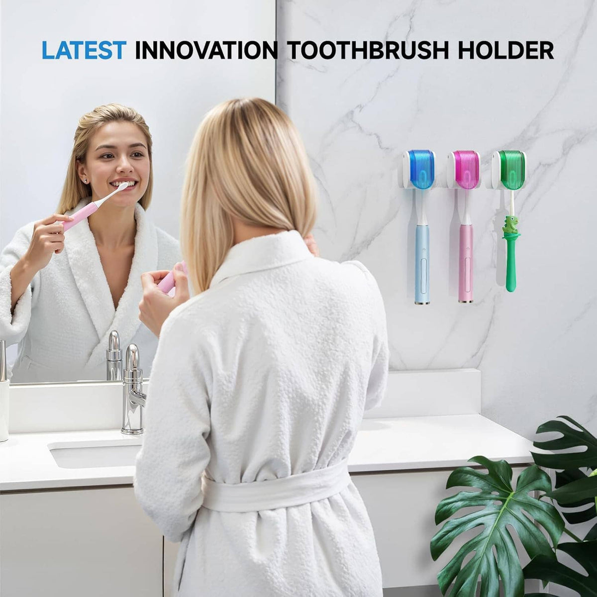 Wall-mounted toothbrush holders in blue, pink, and green next to a bathroom sink