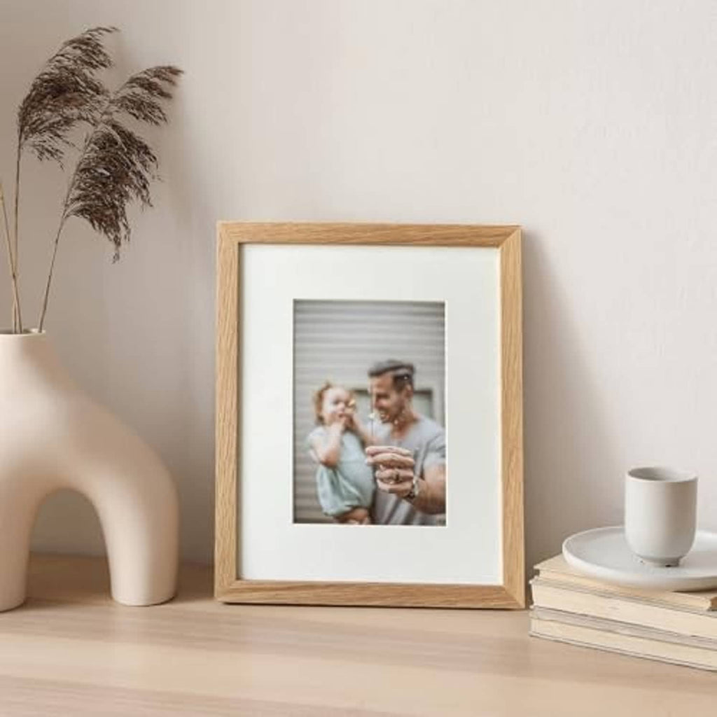 Natural oak 8x10 photo frame displaying a small centered picture