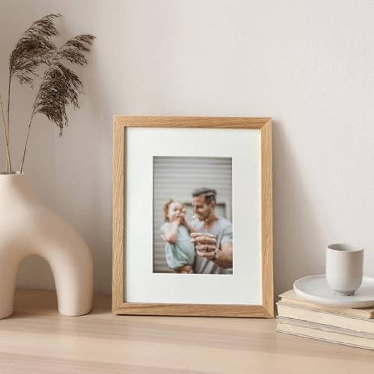 Natural oak 8x10 photo frame displaying a small centered picture