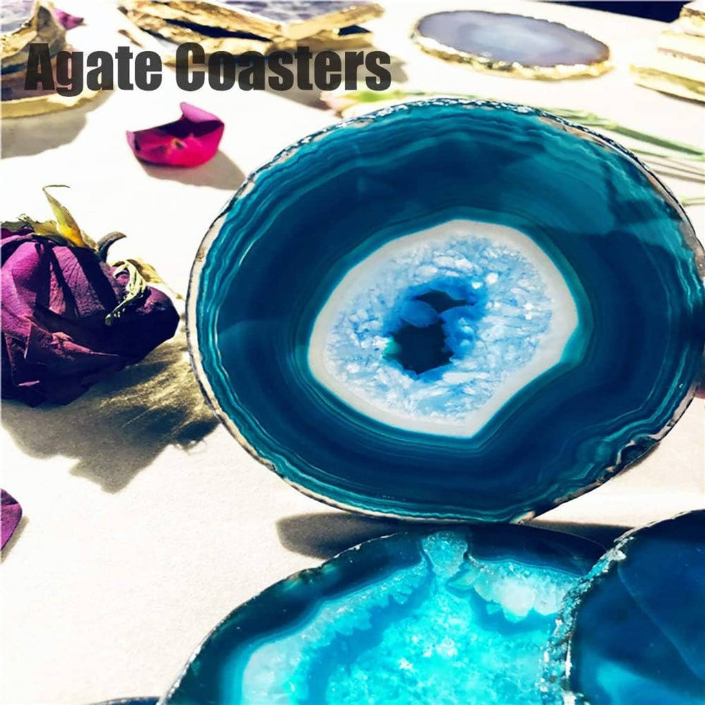 Teal agate geode coaster pair with blue crystal cores and swirling layered bands