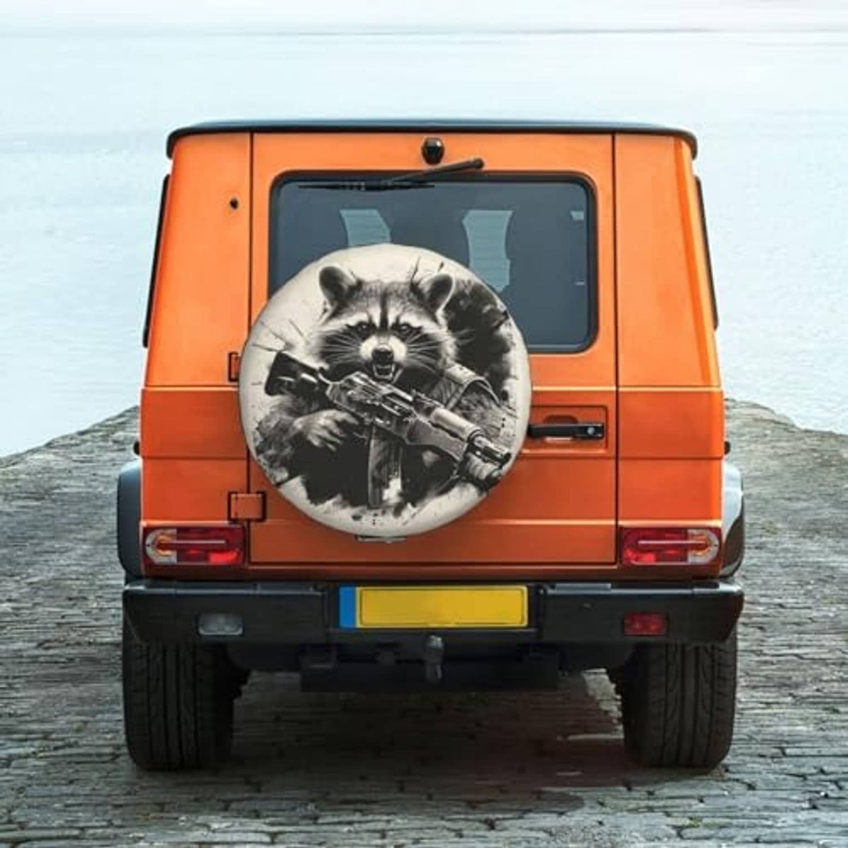 Raccoon spare tire cover on rear of an orange vehicle