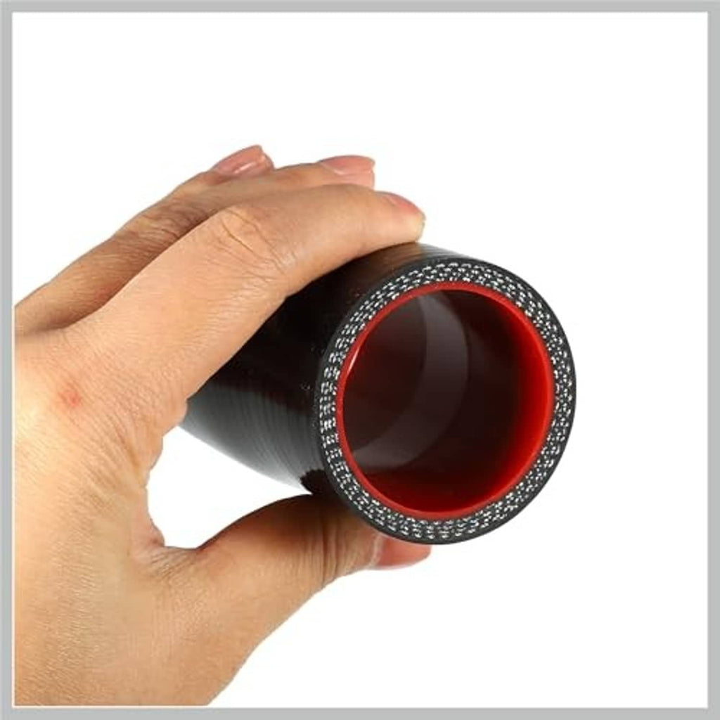 Straight silicone hose coupler held in hand, black outer with red inner opening