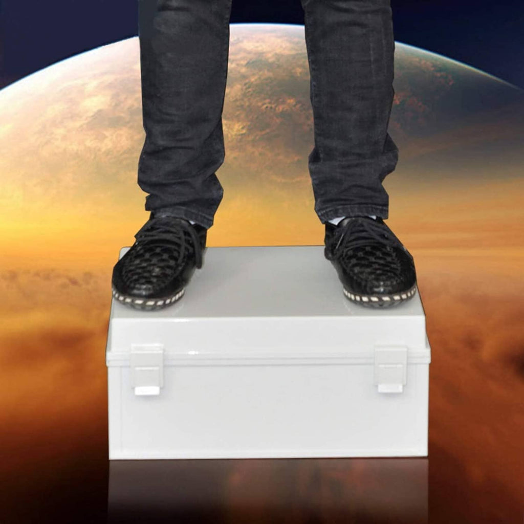 White electrical enclosure box with hinged top, shown carried with work boots