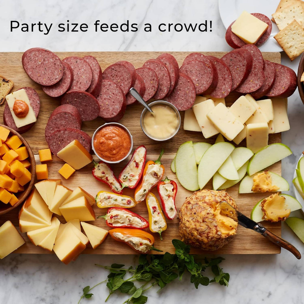Party platter of Beef Summer Sausage slices with cheese cubes, fruit, and dip cups