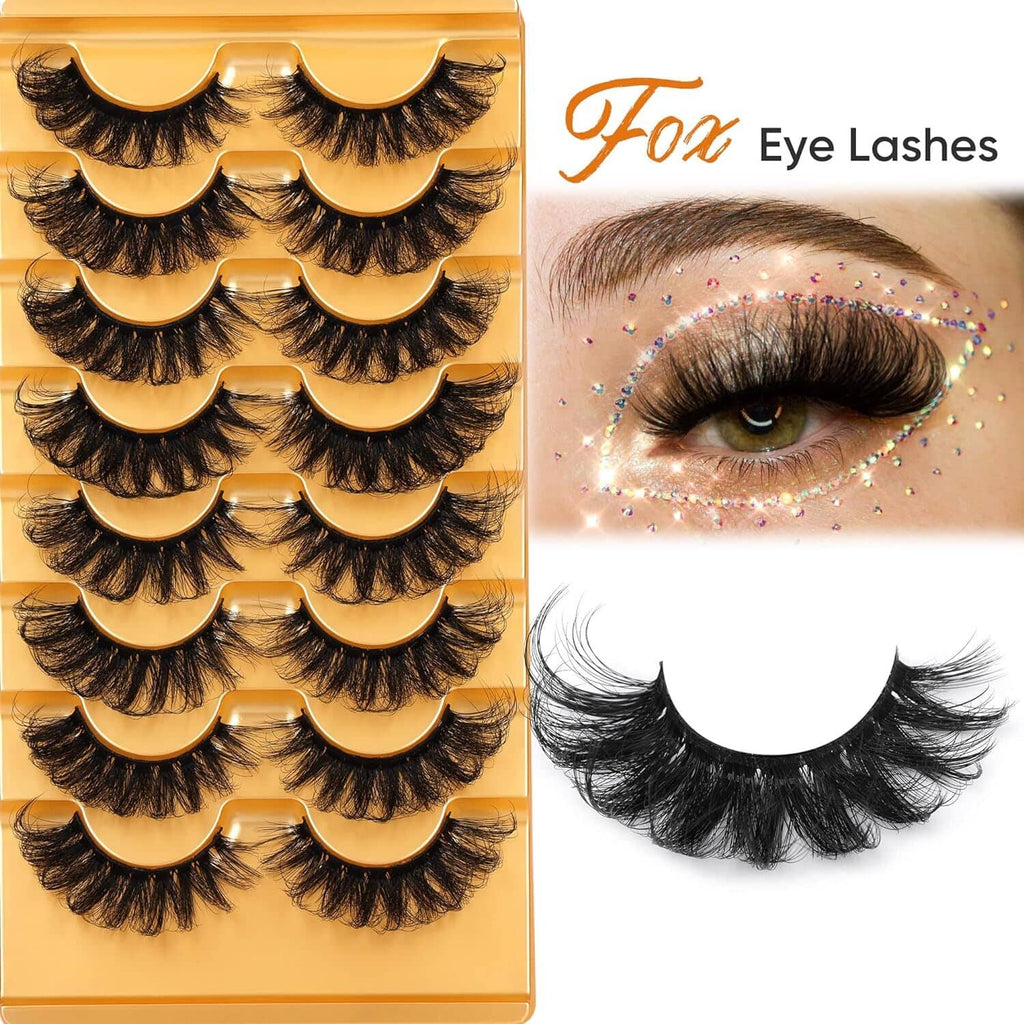 Curled fluffy false eyelash strips in a box, multiple pairs shown with golden bands