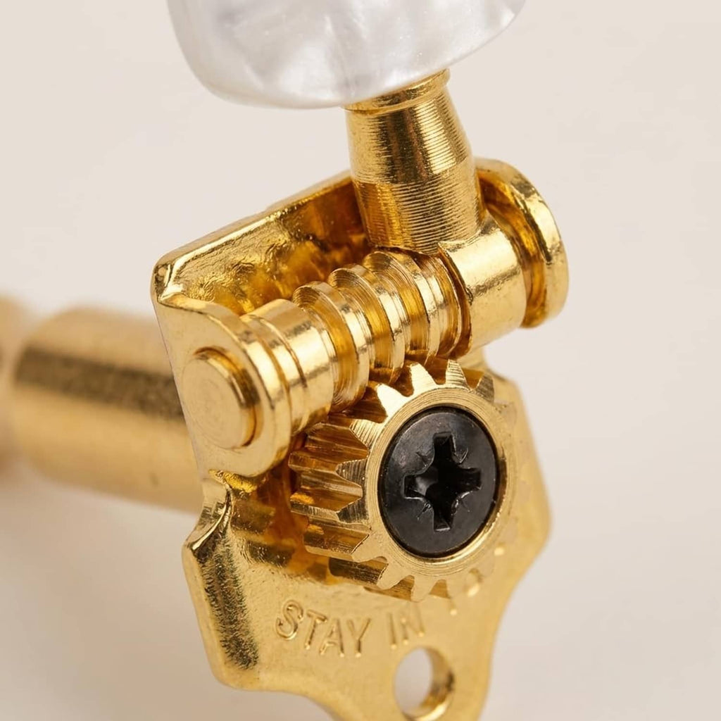 Gold tuning peg with knurled adjustment screw and black gear insert for classical guitar