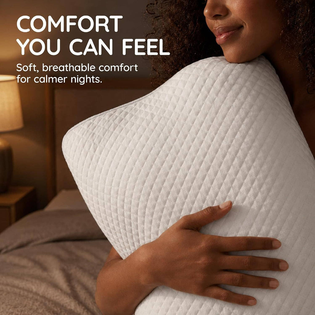 White contour memory foam neck pillow held in hands for comfort