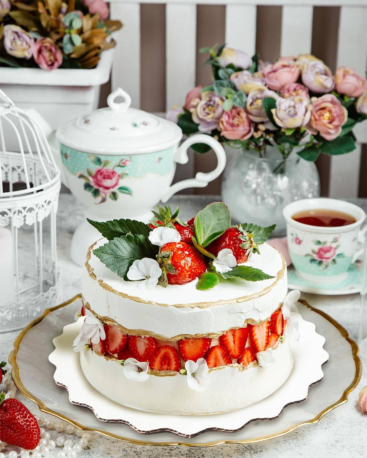 White round wave cake board under a decorated cake, scalloped edge
