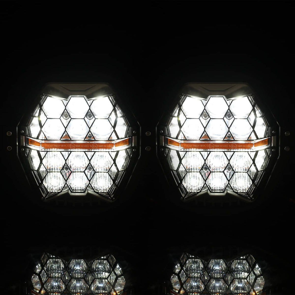 LED headlights lit, bright white multi-lens pattern with orange DRL strip