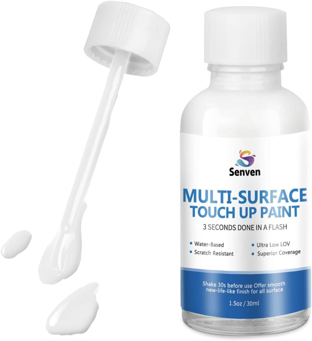 White multi-surface touch-up paint bottle with attached nozzle applicator and paint smears