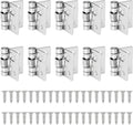 Set of small iron spring-loaded self-closing hinges with latch arms and mounting screws