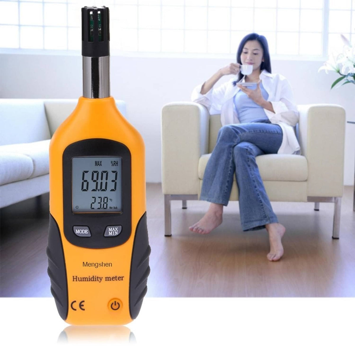 Orange and black handheld digital psychrometer with dual LCD readings for humidity and temperature