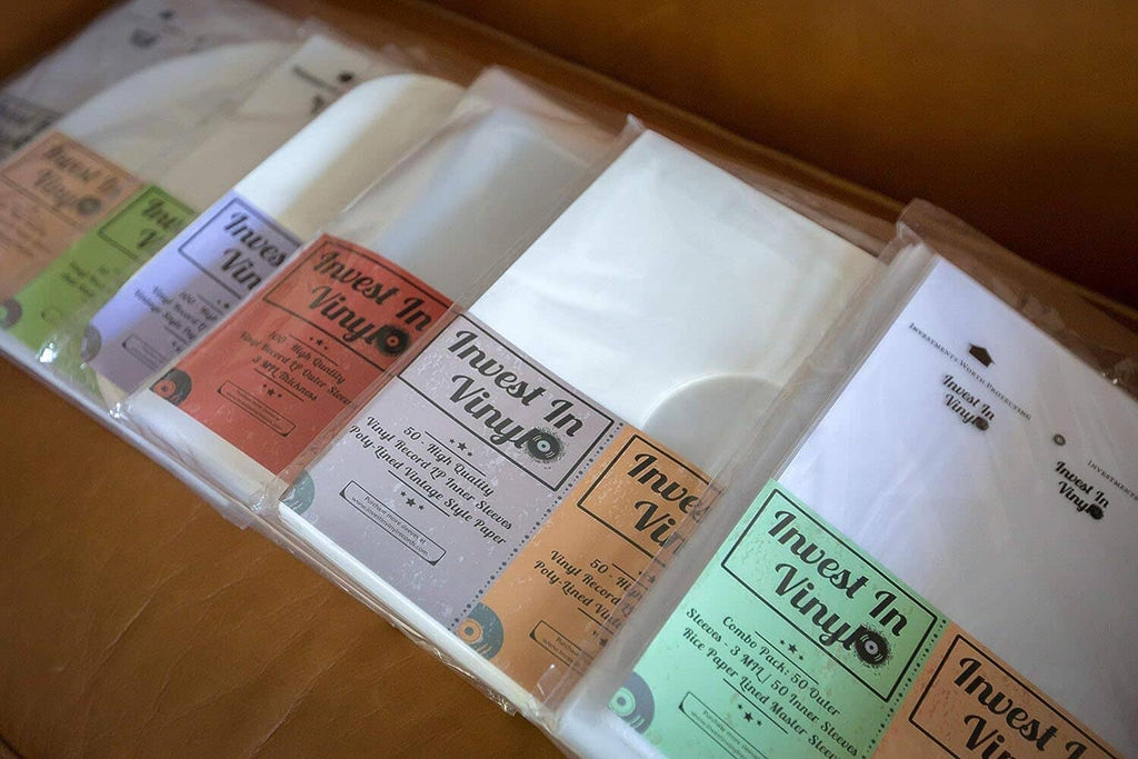 Clear LP outer sleeves laid in a row with multiple labeled packs