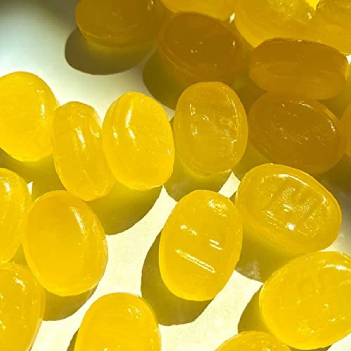 Close-up of round yellow honey lemon cough drops