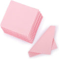 Pink jewelry cleaning cloth set with folded square plus triangular cloth, textured surface