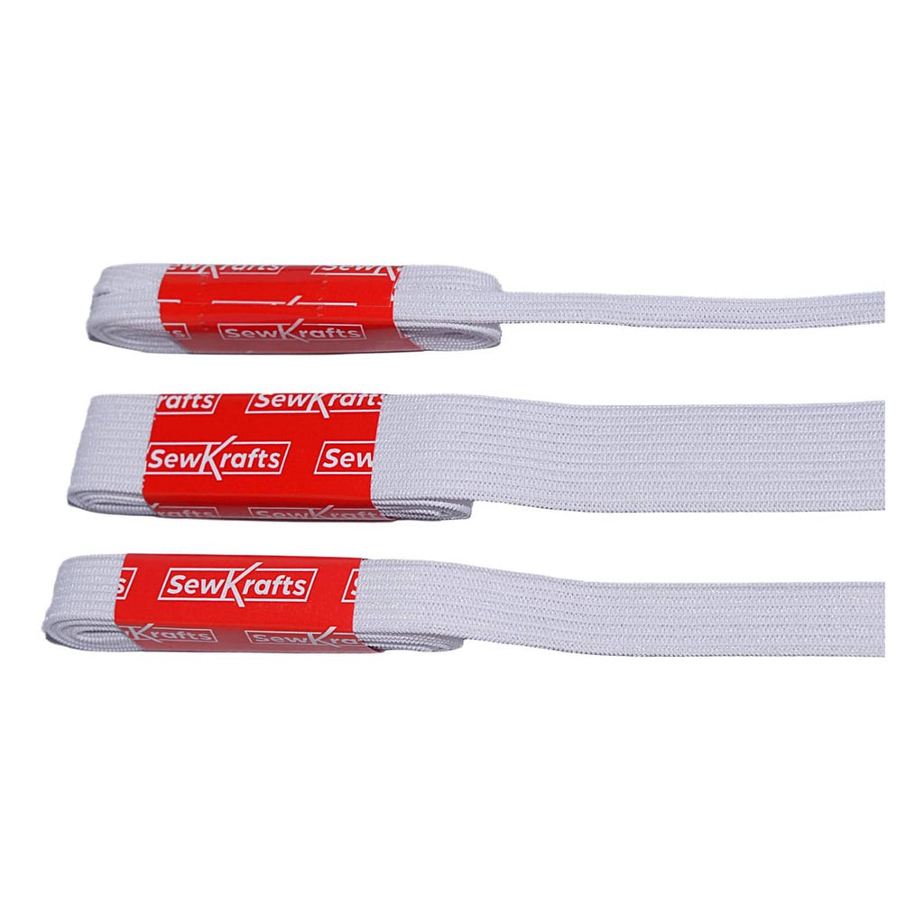 White knit elastic bands laid flat, three widths side by side