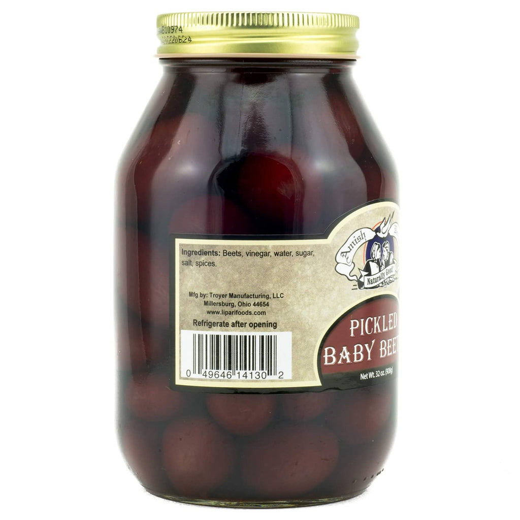 Jar of pickled baby beets with ingredients label, dark red beets in glass jar