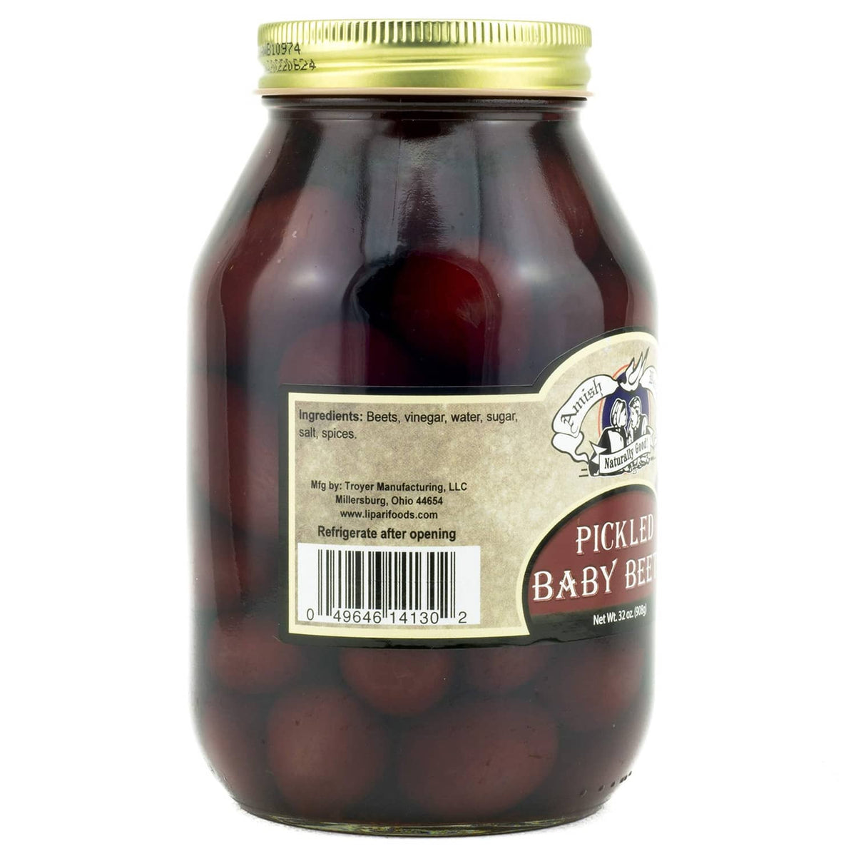 Jar of pickled baby beets with ingredients label, dark red beets in glass jar