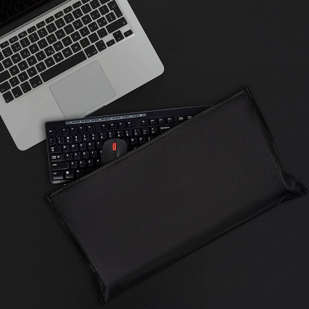 Black dust cover pouch laid open with a keyboard and mouse inside