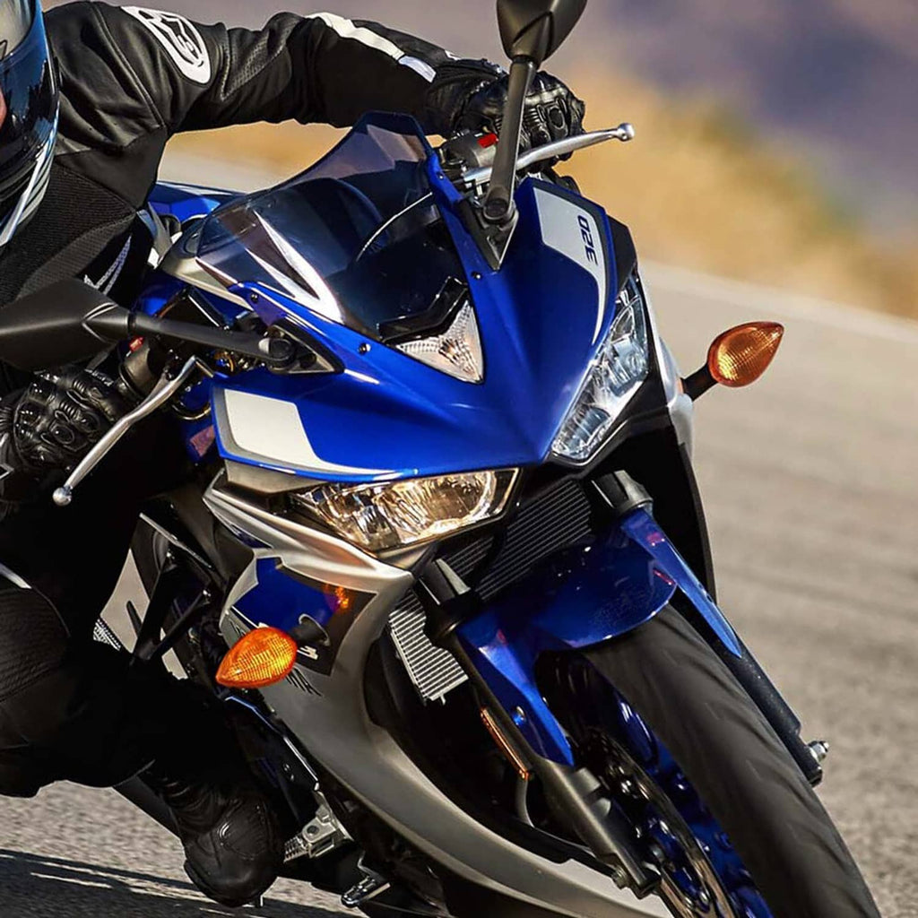 Motorcycle headlight assembly with clear lens on blue front fairing