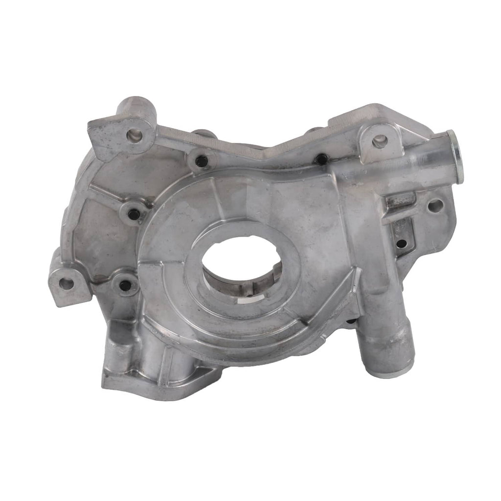 Engine oil pump housing with central circular bore, side outlet, and mounting tabs