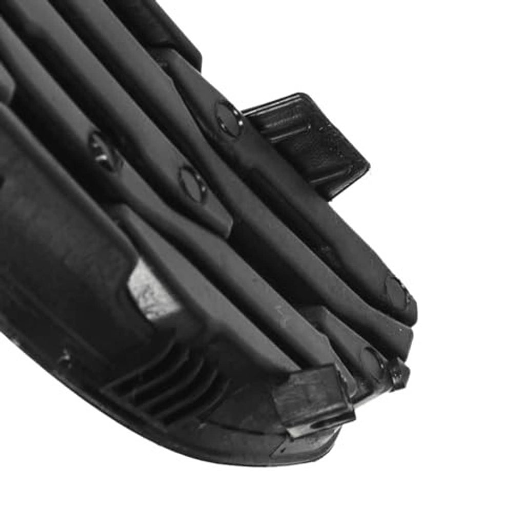 Close-up of black slat grille insert cover edge with mounting clip