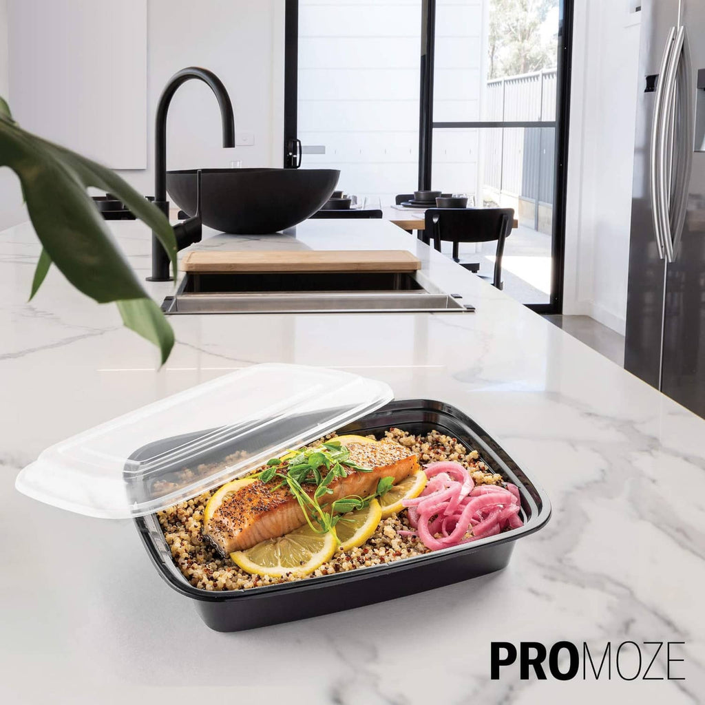 Black reusable meal prep container with clear lid and prepared food