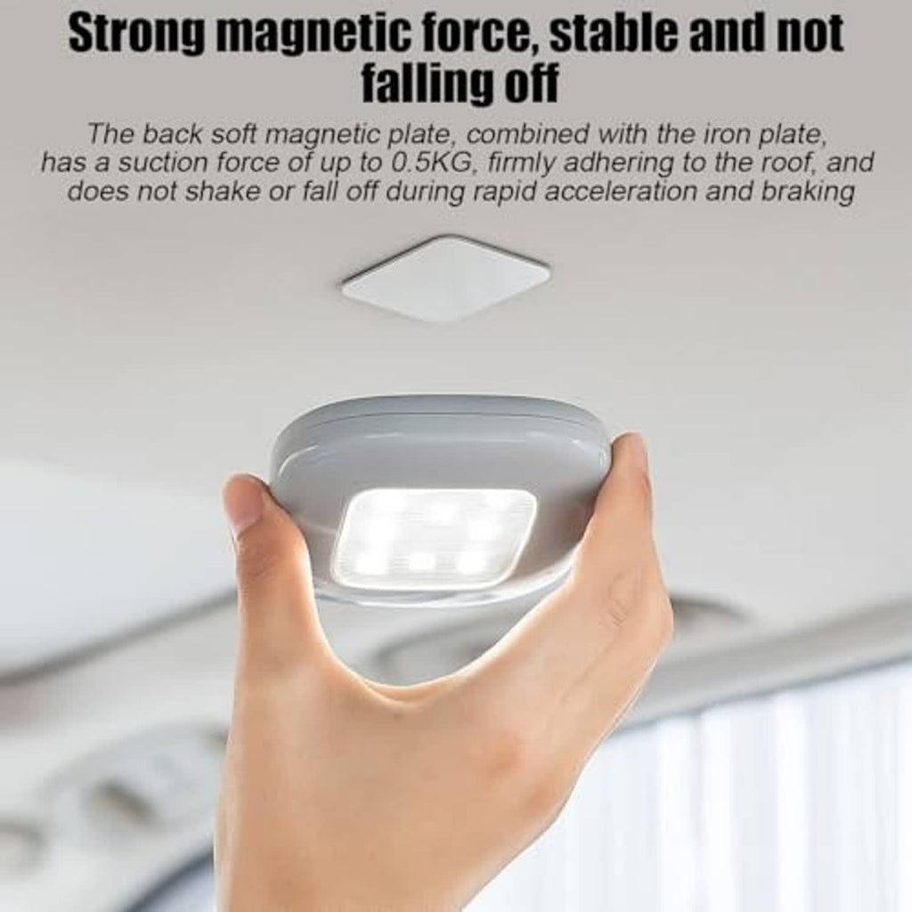 Beige magnetic dome LED light held near ceiling, glowing light panel