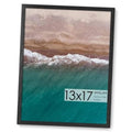 Black wooden 13x17 picture frame with textured ocean print behind glass
