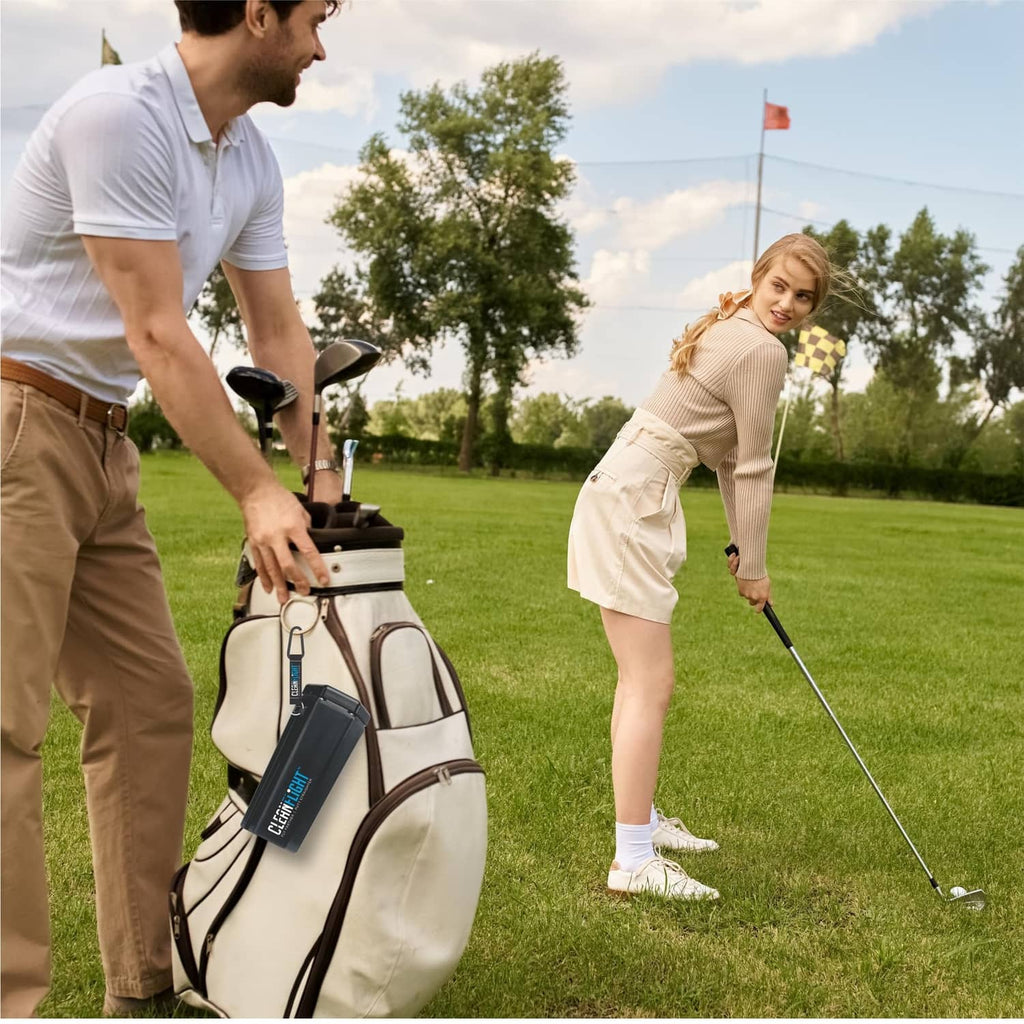 Clean Flight portable golf ball washer on a golf bag with attached bottle