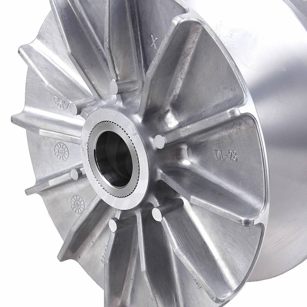 Close-up of silver clutch flywheel with central shaft opening and stamped markings