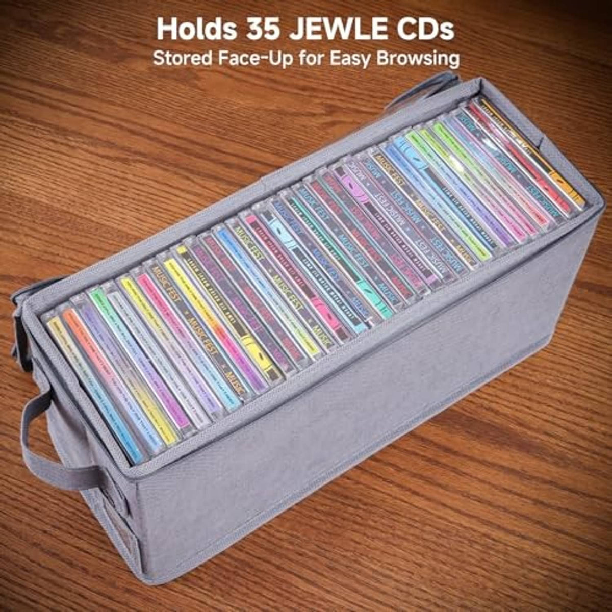 Dark gray CD storage case holding face-up discs with carry handles and front label pocket