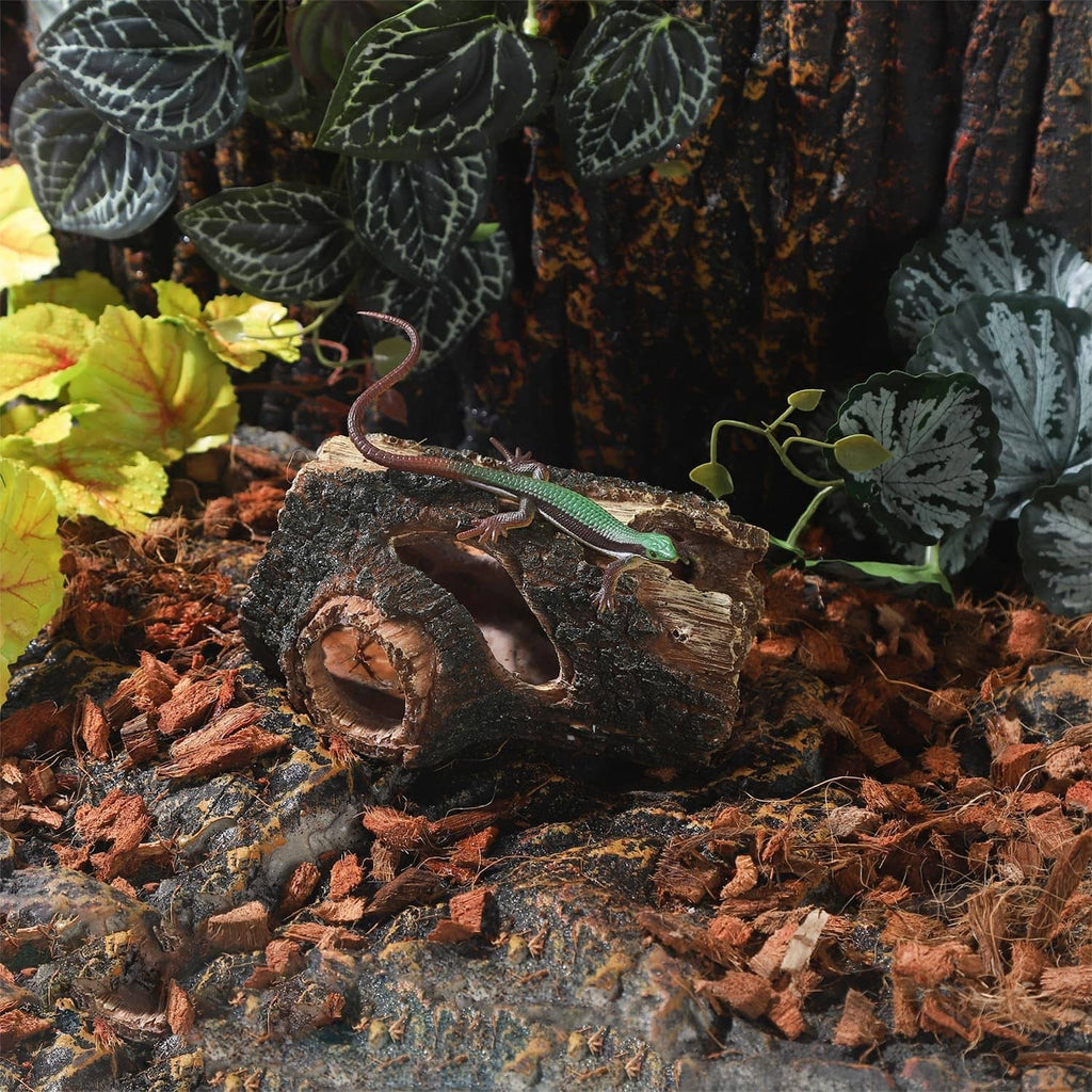 Aquarium resin log hideout with a large curved tunnel opening and dark bark texture