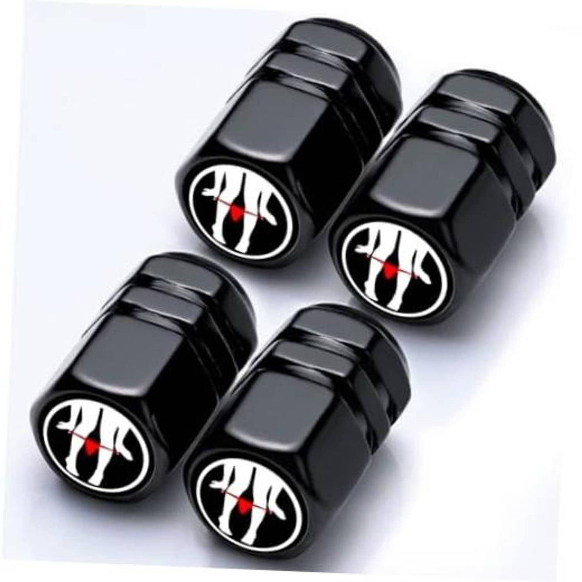 Set of four black tire valve caps with red flame graphic on round tops.