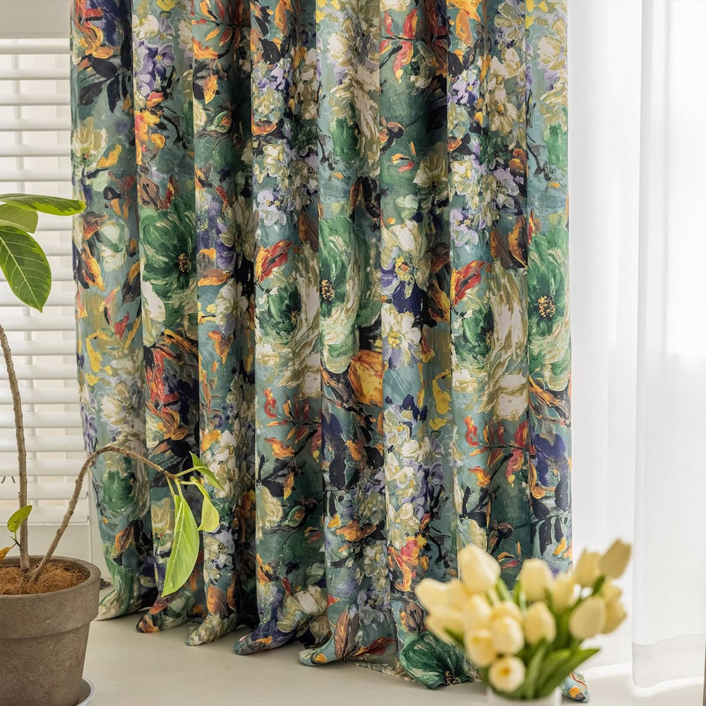 Green floral curtain panels with multicolor botanical print, hanging in a window