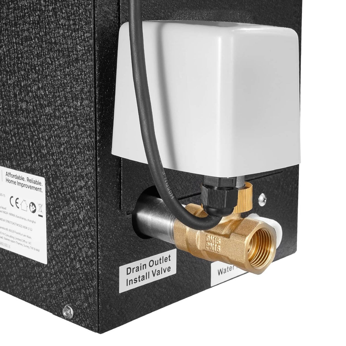 Sauna steam generator control box with brass water valve and white filter housing close-up