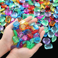 Jumbo acrylic toy gems, multicolor faceted stones in open hand