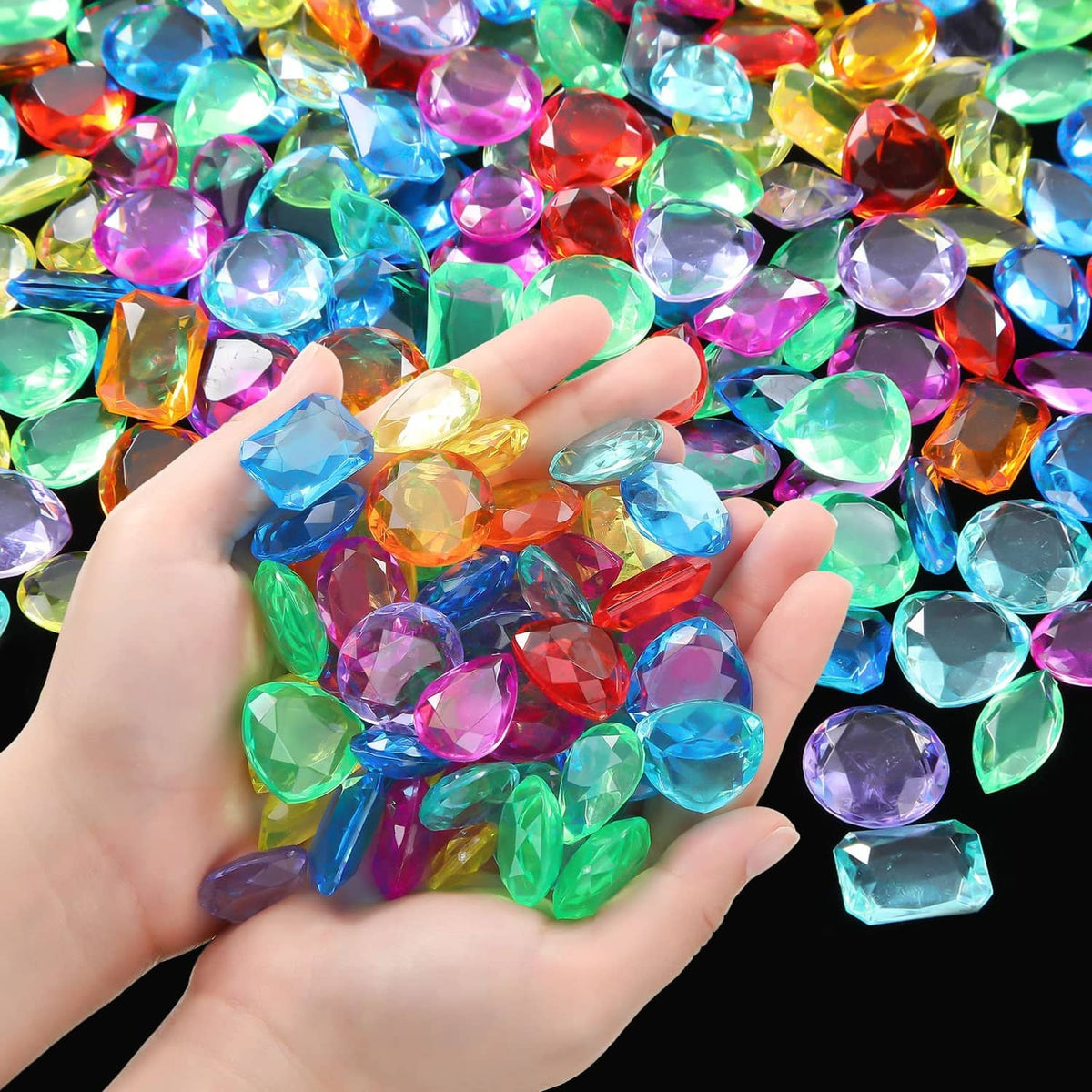 Jumbo acrylic toy gems, multicolor faceted stones in open hand