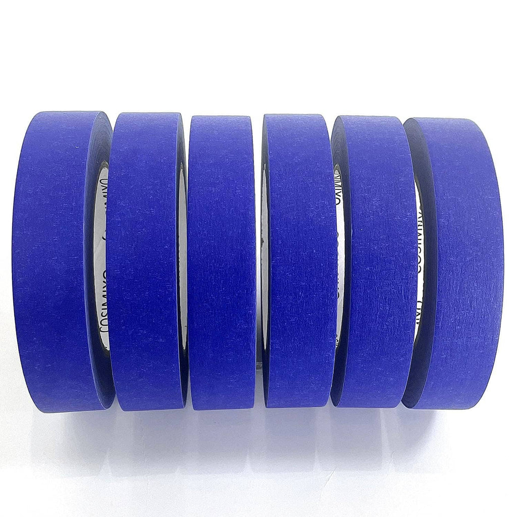 Rolled blue painter’s tape with multiple layers and visible roll edge.