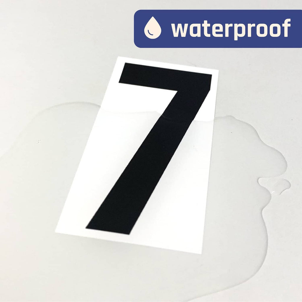 Black vinyl number sticker, large “7” on white backing