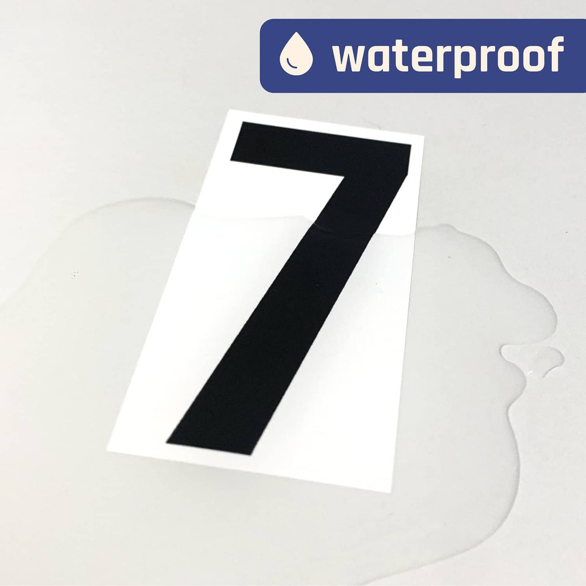 Black vinyl number sticker, large “7” on white backing