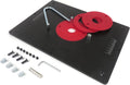 Router table insert plate with red circular inserts and mounting hardware, black anodized plate.