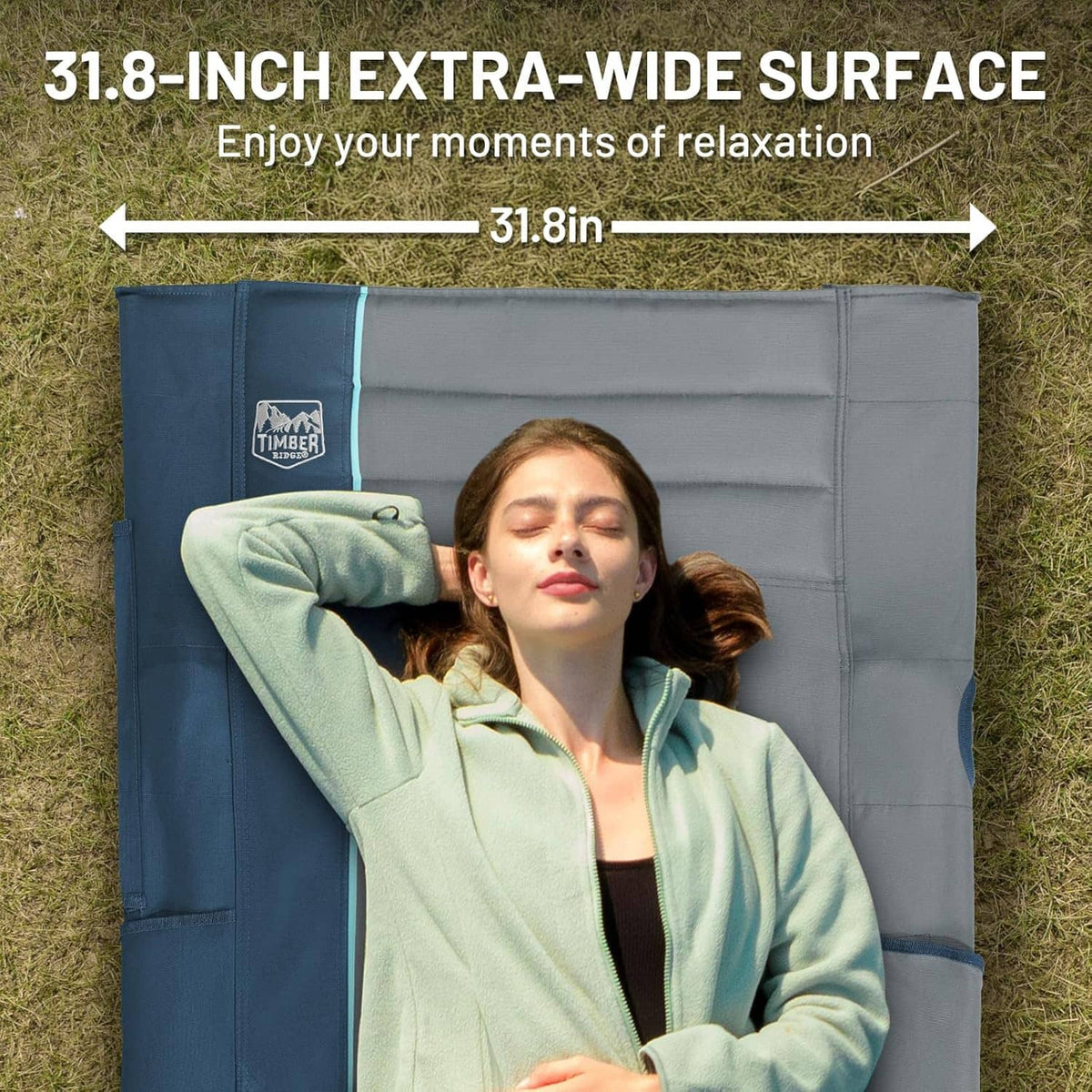 Extra-wide camping cot back panel with padded headrest and blue trim, gray fabric
